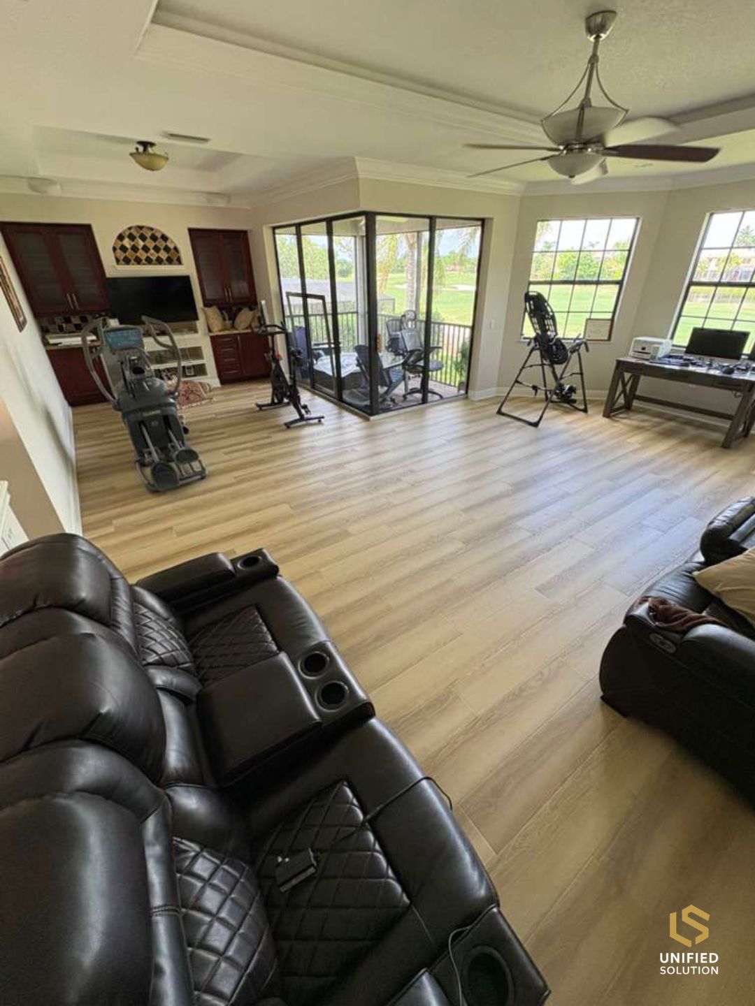 Open-plan living room with new light oak vinyl plank flooring