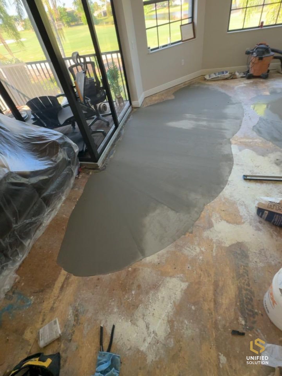 Self-leveling compound poured over a Florida concrete slab