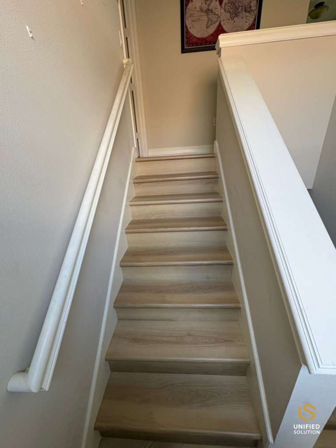 Staircase finished with matching vinyl plank treads and risers